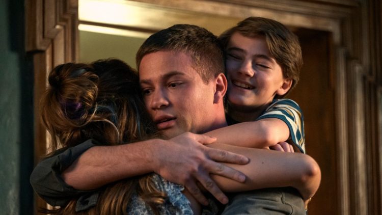 Jackson Robert Scott as Bode Locke, Connor Jessup as Tyler Locke, and Emilia Jones as Kinsey Locke in a group hug in Locke & Key.