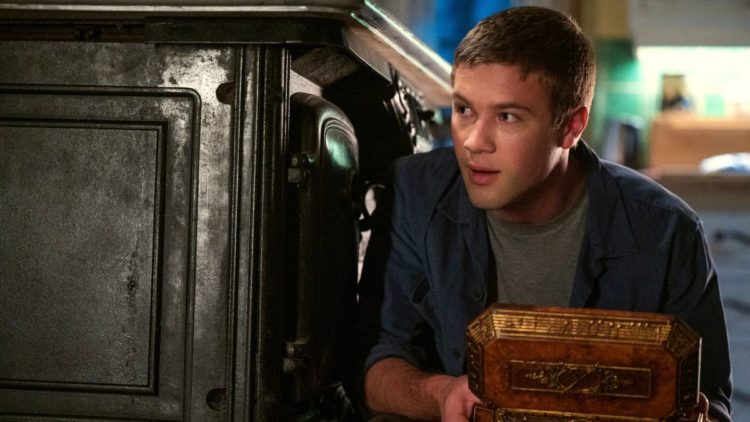 Connor Jessup as Tyler Locke standing in a house foundation in Locke & Key