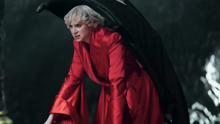Gwendoline Christie as Lucifer Morningstar in a red dress andman