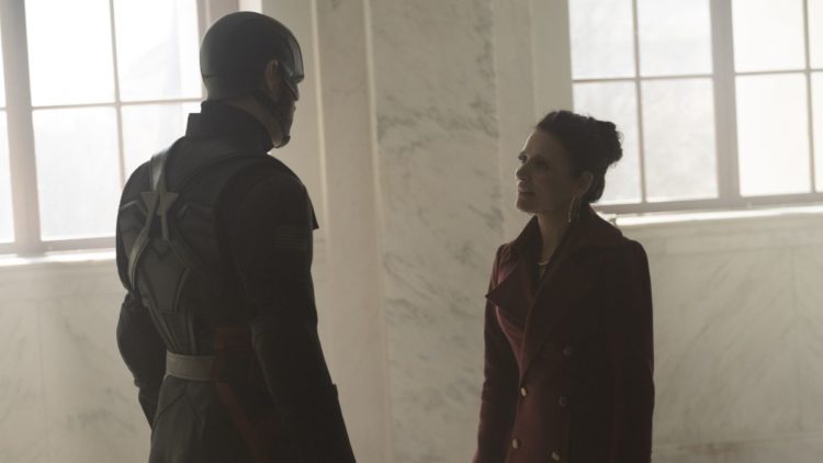 ohn Walker/U.S. Agent (Wyatt Russell) and Valentina Allegra DeFontaine (Julia Louis-Dreyfuss) talking in a white room in The Falcon and The Winter ...