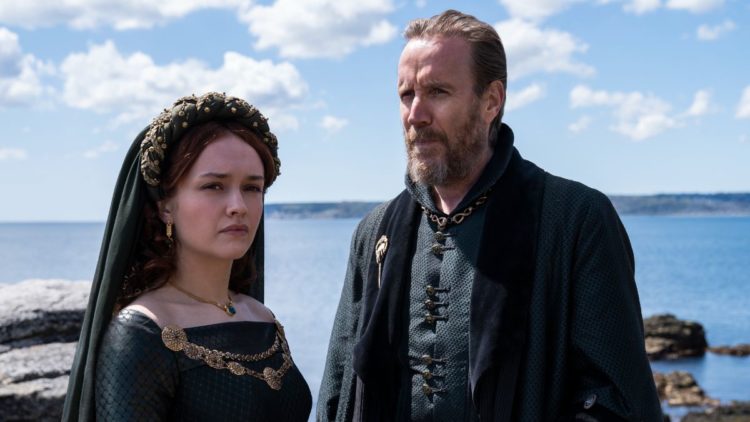 Olivia Cooke as "Alicent Hightower" and Rhys Ifans as "Otto Hightower" on the coast in House of the Dragon
