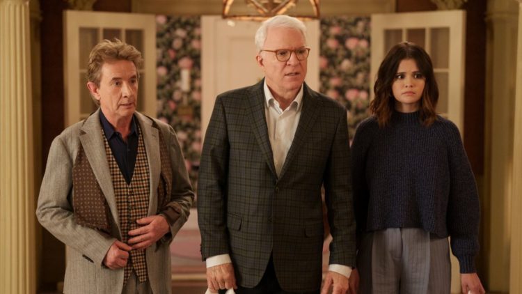 Oliver (Martin Short), Charles (Steve Martin) and Mabel (Selena Gomez) standing with shopping bags in Only Murders in the Building