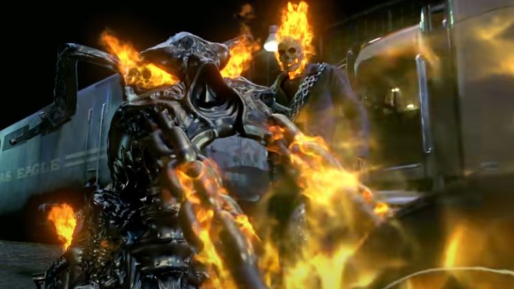 Nicolas Cage as Ghost Riders with a burning motorcycle in front of a train in Ghost Rider