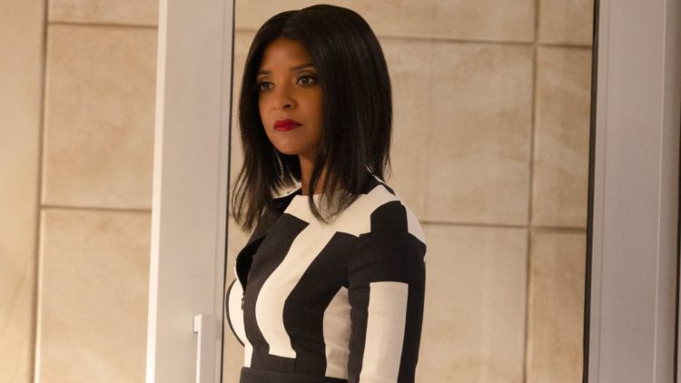 Renée Elise Goldberry as Mallory Book in a black and white suit in She-Hulk: Attorney at Law