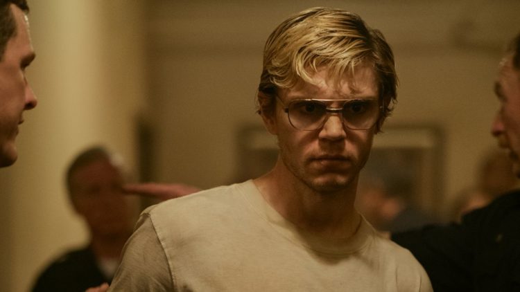 Evan Peters as Jeffrey Dahmer being arrested by officers in episode 101 of Dahmer. Monster: The Jeffrey Dahmer Story.