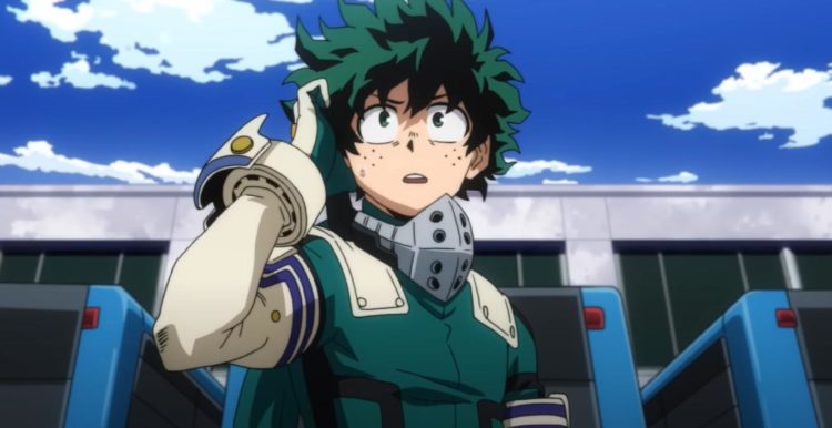 Deku holds a speaker to his ear whilst standing under a bridge in his combat suit