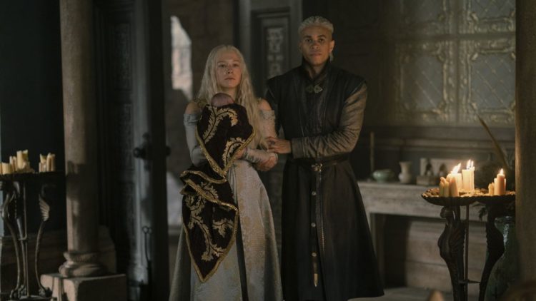 Emma D'Arcy and John MacMillan as Rhaenyra and Laenor holding their newborn in House of the Dragon Episode 6