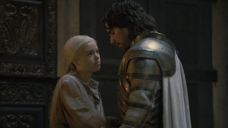 Milly Alcock, Fabien Frankel as Rhaenyra and Ser Criston standing at a doorway in House of the Dragon
