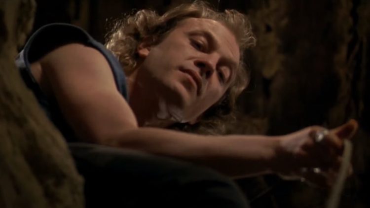 Buffalo Bill looking down a well in Silence of the Lambs
