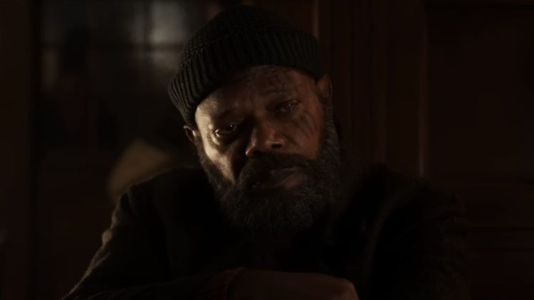 Samuel L. Jackson as Nick Fury sitting at a table with a beanie in Secret Invasion