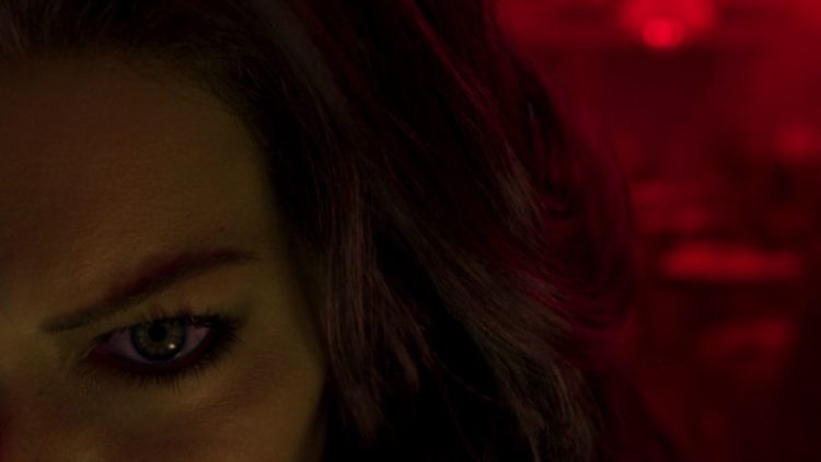 Close up of She-Hulk with a red light in She-Hulk: Attorney at Law Episode 8