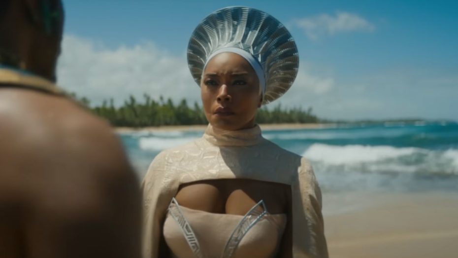 Angela Bassett as Ramonda standing with Namor on a beach in Black Panther: Wakanda Forever