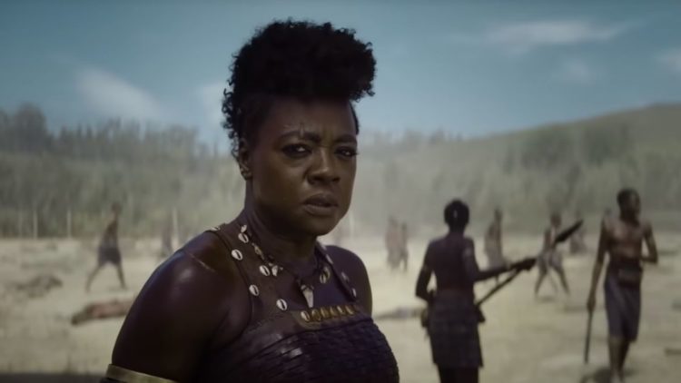 Viola Davis standing on the battlefield in The Woman King
