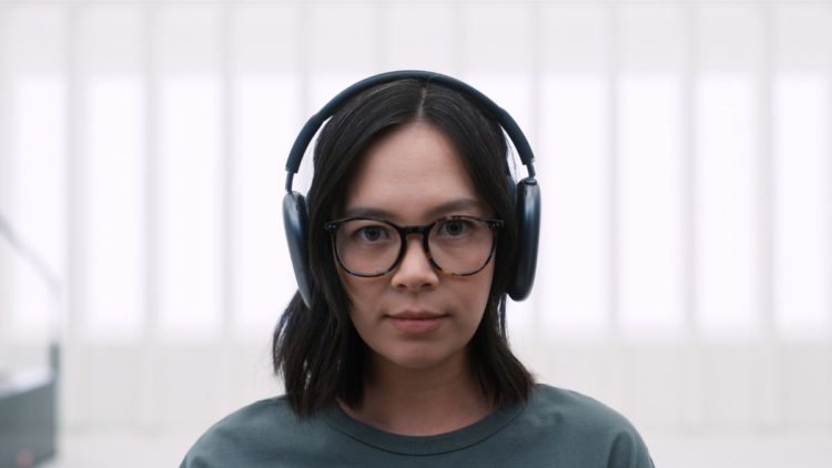 Charlotte Nicdao wearing headphones in Mythic Quest Season 3