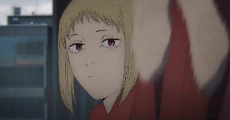 Akane Sawatari flicks her wrist whilst staring at the camera