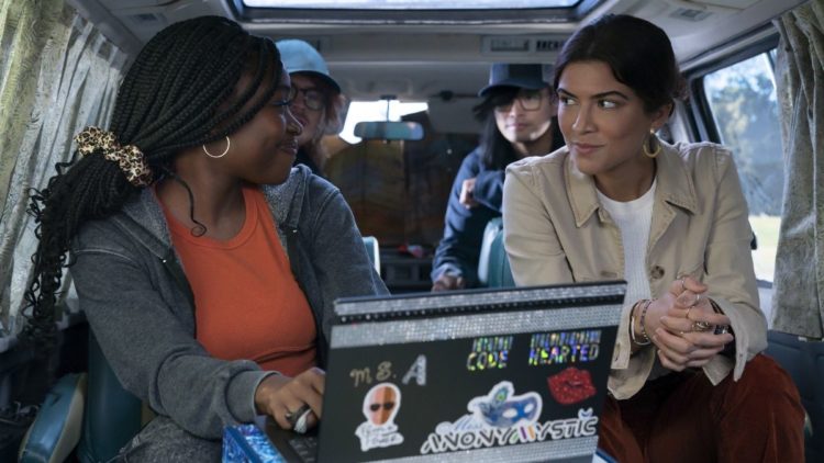 Zuri Reed and Lisette Olivera next to a laptop in National Treasure: Edge of History