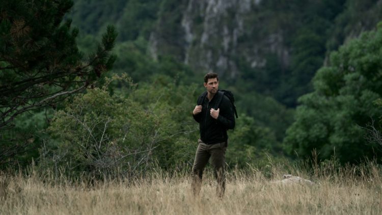 John Krasinski as Jack walking in a field in Tom Clancy's Jack Ryan Season 3