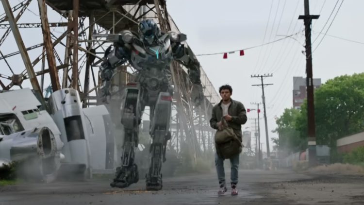Anthony Ramos and an Autobot in Transformers: Rise of the Beasts
