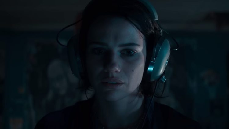 Lilly Sullivan with headphones in Evil Dead Rise