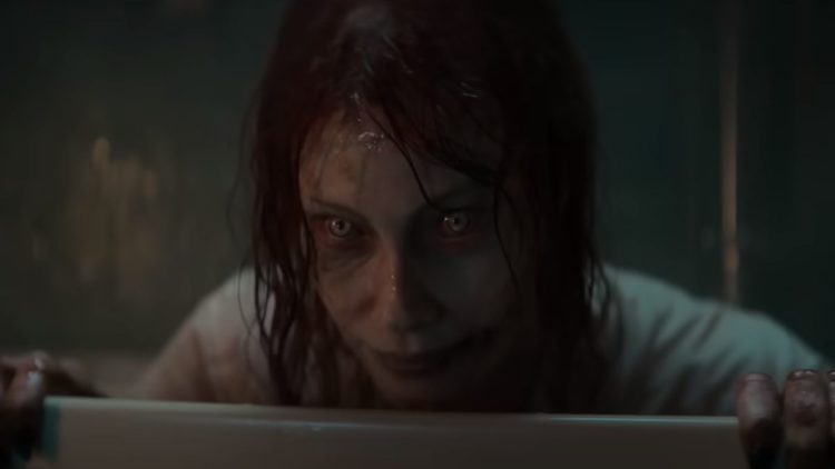 Alyssa Sutherland possessed in a bath tub in Evil Dead Rise