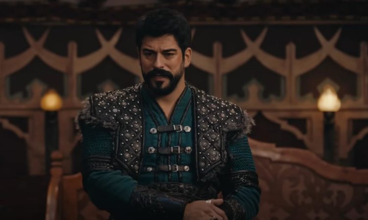 Osman Bey gives a speech to his men whilst holding his sword hilt