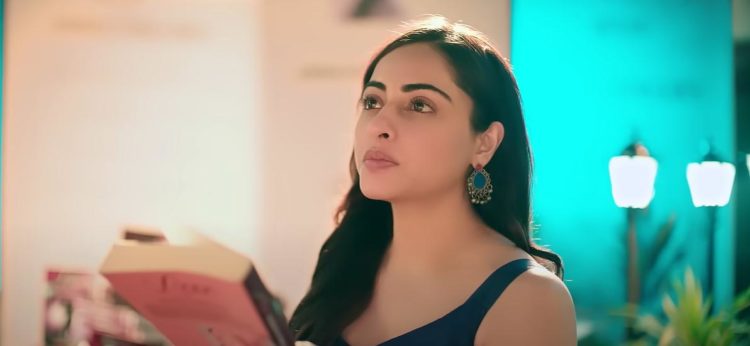 • Niyati Fatnani as Asmita Roy looks at Razdan as she holds his latest novel