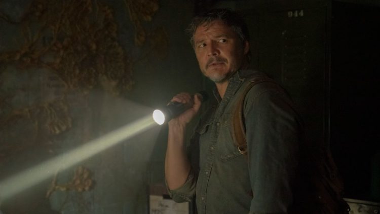 Pedro Pascal as Joel holding a flashlight in HBO's The Last of Us