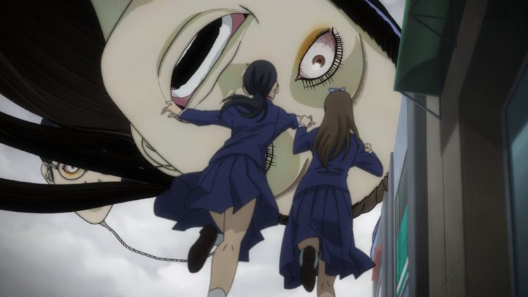 Human balloon looks down on girls in Junji Ito Maniac: Japanese Tales of the Macabre