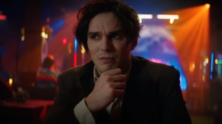 Nicholas Hoult sitting in a bar in Renfield