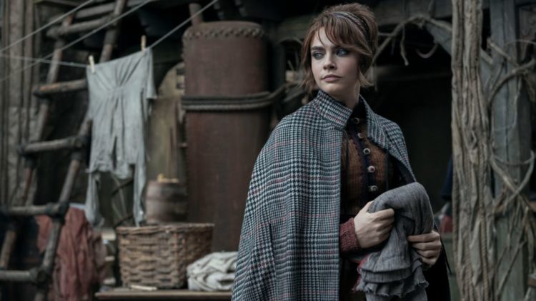 Cara Delevingne as Vignette Stonemoss in a tweed cape in Carnival Row