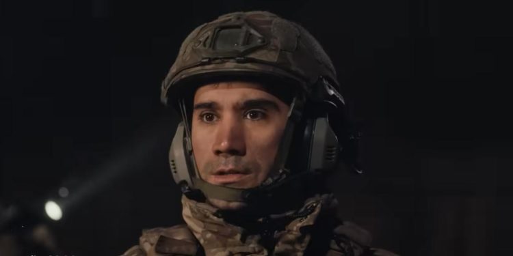 Ugur Gunes as Captain Ali Banazli looks shocked watching a night operation unfold