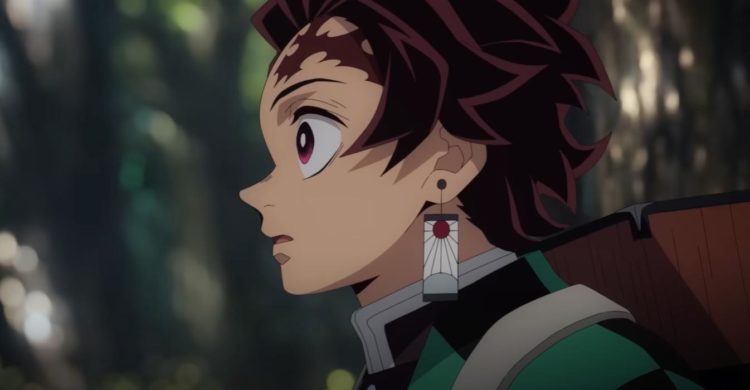 Tanjiro runs through a forest with Nezuko's box on his back