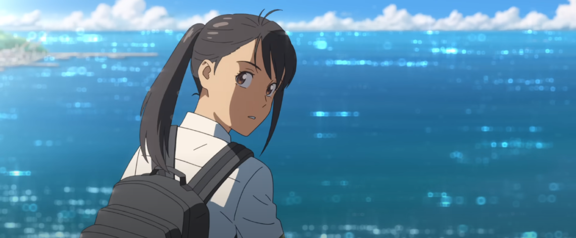 Suzume looks back at Shouta from a hill above the ocean